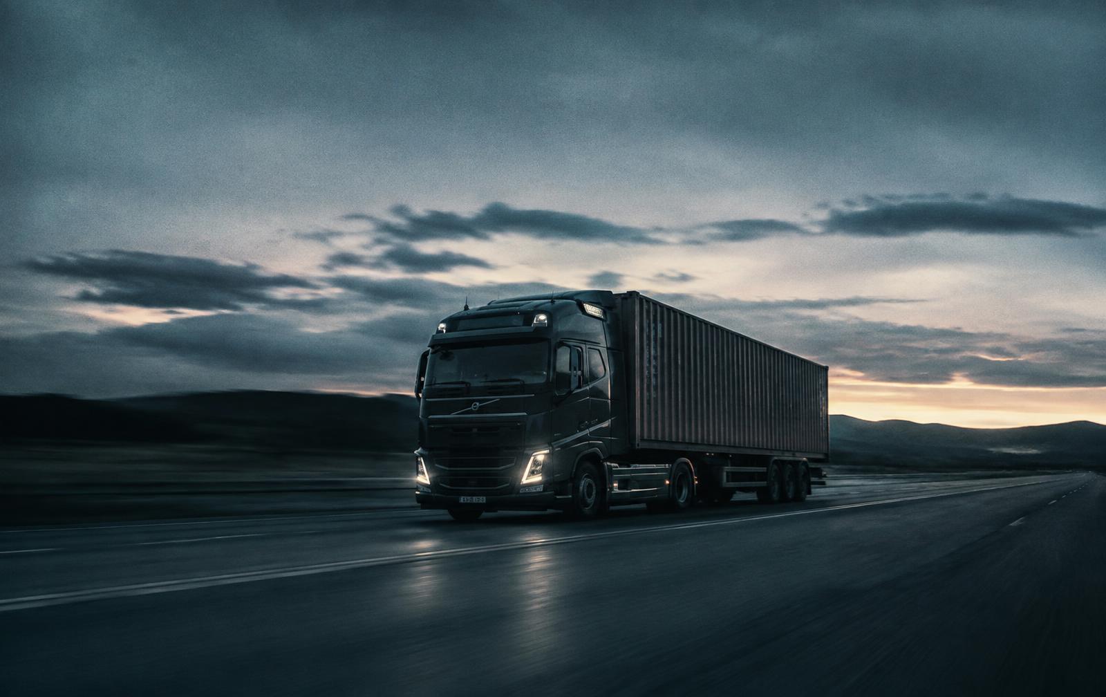 Container truck on a highway at dusk